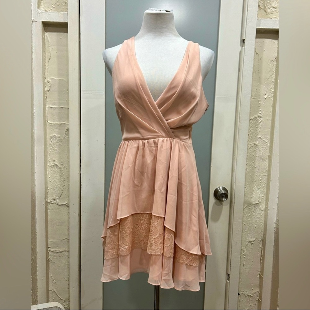 Beautiful BCBG short light pink dress. V neck see Thur lace back.